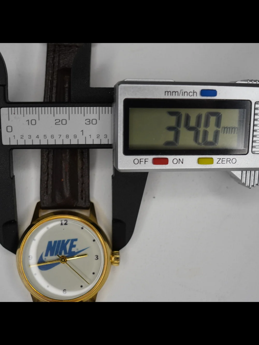 Vintage 1990s Nike Swoosh Logo Men's Quartz Watch Gold Tone White Dial